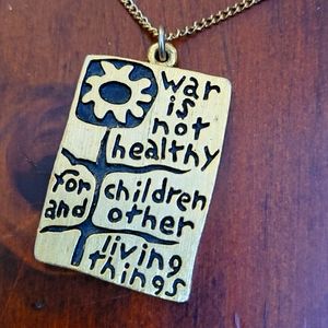 1968 "WAR IS NOT HEALTHY" necklace